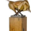 Casa Padrino Designer Bronzefigur Stier Bronze / Gold / Braun 43,5 x 12,9 x H. 44,5 cm - Bronze Skulptur mit Holzsockel - Wohnzimmer Deko - Schreibtisch Deko - Elegante Dekofigur