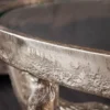 Casa Padrino Designer Couchtisch Antik Bronze Ø 56 x H. 53 cm - Runder Wohnzimmertisch mit 3 dekorativen Stierköpfen und Glasplatte - Wohnzimmer Möbel