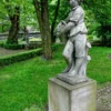 Casa Padrino Jugendstil Skulptur Junge mit Korb Antik Stil Grau 48 x H 120 cm Antikstil - Barock Gartendeko - Schwer und Massiv