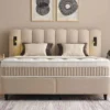Casa Padrino Luxus Boxspringbett mit gewelltem Kopfteil und Leseleuchten Beige 140 x 200 cm - Luxus Schlafzimmer Möbel