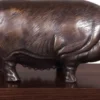 Casa Padrino Luxus Bronzefigur Schwein auf Holzsockel Bronze / Dunkelbraun 35 x 17 x H. 19 cm - Deko Figur