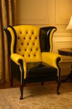 Casa Padrino Luxus Chesterfield Leder Ohrensessel Gelb / Schwarz / Braun H. 110 cm