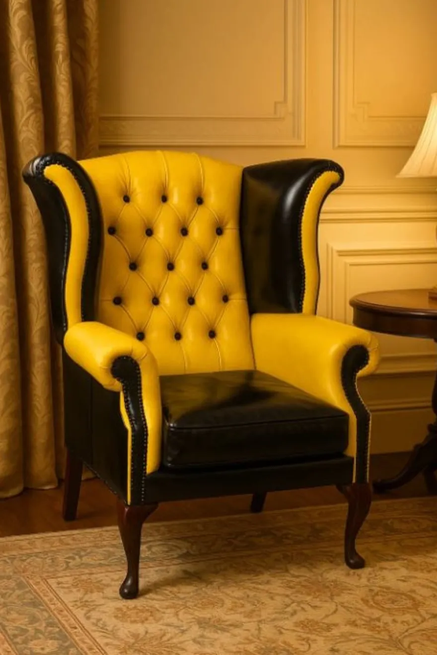 Casa Padrino Luxus Chesterfield Leder Ohrensessel Gelb / Schwarz / Braun H. 110 cm