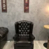 Casa Padrino Luxus Chesterfield Leder Ohrensessel Schwarz - Chesterfield Echtleder Wohnzimmer Sessel - Wohnzimmer Möbel - Chesterfield Möbel - Echtleder Möbel - Luxus Möbel - Luxus Einrichtung