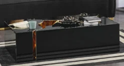 Casa Padrino Luxus Couchtisch Schwarz / Gold 110 x 70 x H. 43 cm - Rechteckiger Wohnzimmertisch - Wohnzimmer Möbel - Luxus Möbel - Luxus Einrichtung - Wohnzimmer Einrichtung