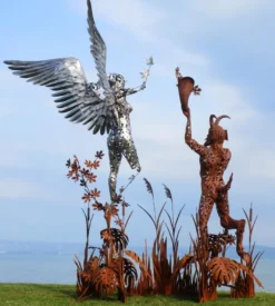Casa Padrino Luxus Deko Skulptur Engel und Pan Rost / Silber 325 x 173 x H. 370 cm - Riesige Metall Skulptur - Riesige Garten Deko Figur - Garten Skulpturen - Metall Skulpturen