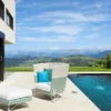 Casa Padrino Luxus Garten Sessel Weiß / Blau / Grün 98 x 85 x H. 104 cm - Handgewebter Wetterbeständiger Hochlehn Sessel - Garten & Terrassen Möbel - Luxus Kollektion