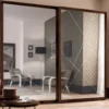 Casa Padrino Luxus Schlafzimmerschrank Braun 295 x 67 x H. 250 cm - Massivholz Kleiderschrank mit 2 Schiebetüren - Schlafzimmer Möbel - Luxus Qualität - Made in Italy