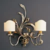 Casa Padrino Luxus Wandleuchte Antikgold B. 57 x H. 80 cm - Handgefertigte Wandleuchte aus Schmiedeeisen - Luxus Kollektion - Edel & Prunkvoll