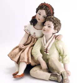 Casa Padrino Porzellan Deko Puppen Skulptur Junge & Mädchen H. 22,5 cm - Made in Italy