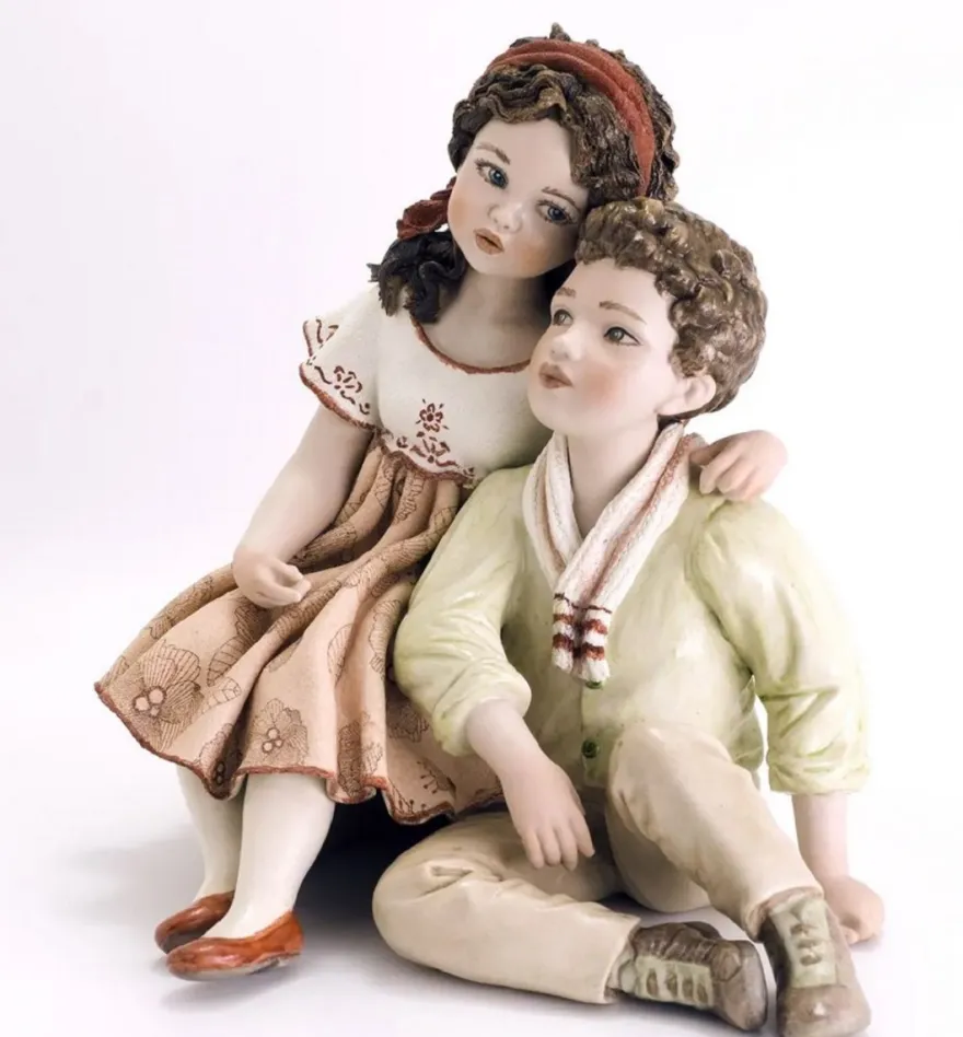 Casa Padrino Porzellan Deko Puppen Skulptur Junge & Mädchen H. 22,5 cm - Made in Italy