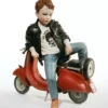 Casa Padrino Porzellan Deko Skulptur Junge mit Roller H. 29 cm - Made in Italy